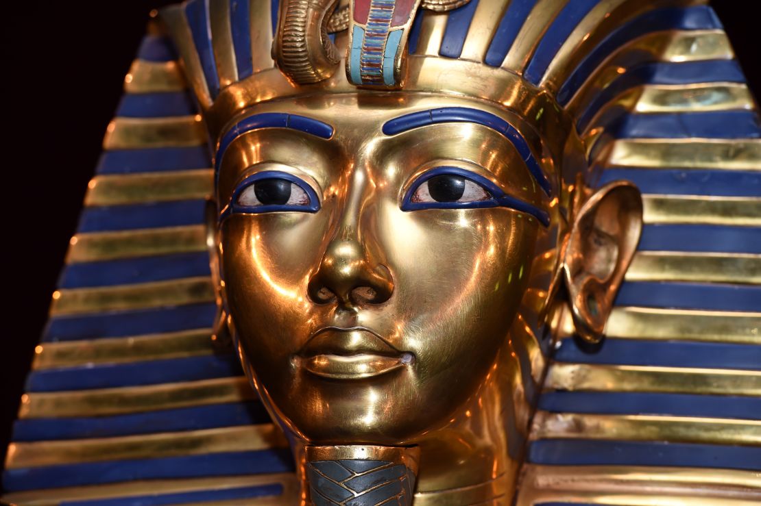 Detail of Tutankhamun’s mask with lapis lazuli blue stripes and gold bands.